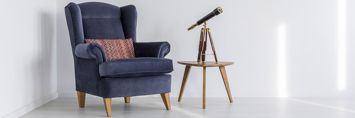 Armchair, table and telescope